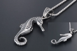Detailed view of silver seahorse pendant showing intricate scales and textures on steel