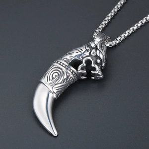 Retro punk style wolf tooth pendant necklace for men with engraved wolf head detail