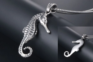 Detailed multi-angle view of a vintage silver seahorse pendant on a box chain for men