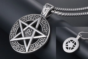 Macro shot of titanium steel pentagram pendant with vintage Celtic knot textures