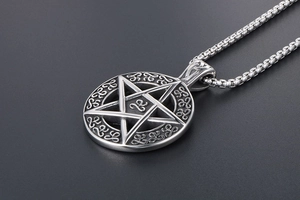 Detailed macro view of retro stainless steel pentagram pendant and durable box chain