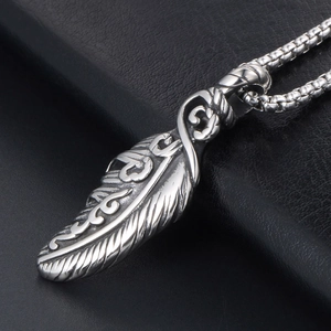 Retro stainless steel feather pendant necklace with detailed textures on black leather