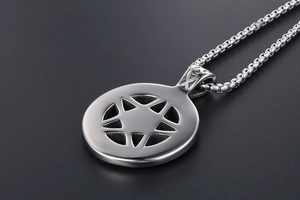 Macro detail of titanium steel necklace with a hollow hexagram star pendant and pearl chain