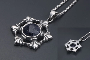 Macro detail of retro titanium steel necklace with blue sand stone star pendant