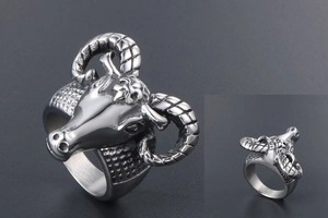 Macro shot of silver antelope ram head ring with detailed horns and vintage metal finish