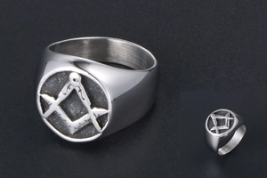 Detailed macro view of silver titanium steel signet ring with Freemasonry symbol
