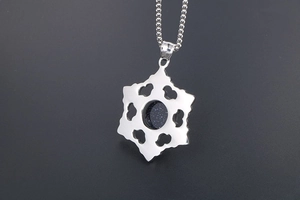 Detailed view of a snowflake pendant with blue sandstone inlay and silver bead chain