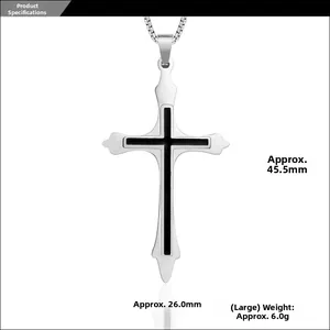 Macro detail of silver titanium steel cross pendant with black enamel center inlay