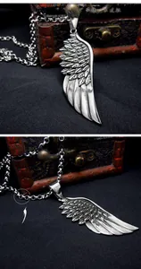 Macro detail of vintage titanium steel feather wing pendant with antique silver finish