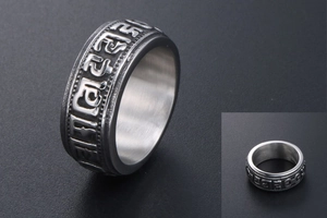 Macro view of retro titanium steel ring with engraved Six-Character Mantra relief