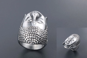 Detailed macro view of Buddha head titanium steel ring with intricate carvings
