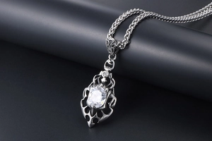 Detailed view of gothic flame pendant with large oval zircon and woven steel chain