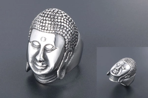 Close-up of retro stainless steel Buddha head ring with detailed relief and vintage finish