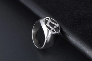 Detailed side view of silver titanium steel signet ring with Masonic compass engraving