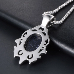 Retro silver pendant necklace with blue sandstone teardrop and ornate scroll patterns