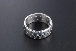 Detail of silver stainless steel ring featuring Cuban chain texture and hollow triangle cutout