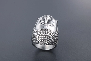 Macro detail of Buddha portrait ring featuring textured silver stainless steel finish