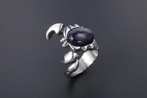 Detailed view of silver scorpion ring with oval blue aventurine stone inlay