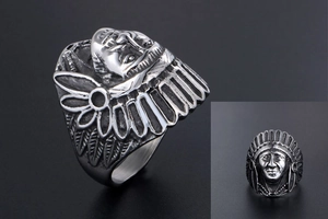 Macro view of vintage Indian chief head ring with detailed feather headdress texture