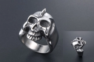 Macro view showing intricate skull details and side profile of the punk steel ring