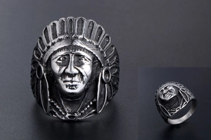 Close-up of vintage Indian chief head ring with detailed feather headdress relief