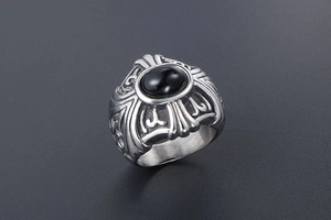 Macro detail of gothic titanium steel ring with large oval black agate stone inlay