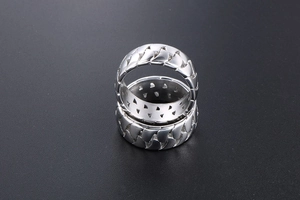 Detail showing two silver Cuban link pattern rings with a polished industrial metal finish