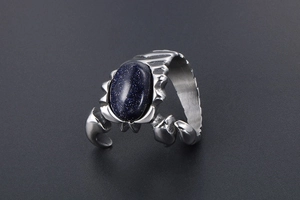 Macro view of a retro titanium steel scorpion ring featuring a blue sandstone centerpiece