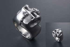 Macro shot of punk skull ring detail with intricate metallic textures and gothic rivets