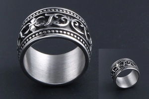 Detailed view of gothic titanium steel ring featuring cross reliefs and vintage textures
