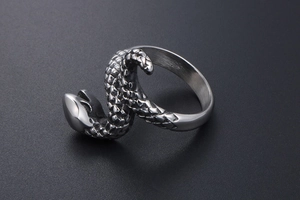 Detailed view of the realistic snake scale texture on a punk style stainless steel ring