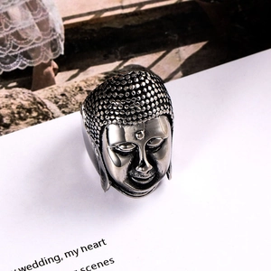 Retro silver Buddha head ring in stainless steel with detailed religious Zen carving