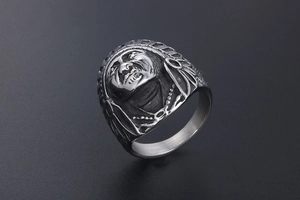 Macro side view of vintage stainless steel Indian chief ring with feather details