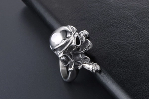 Detailed macro view of punk skull ring with gothic helmet textures on leather surface