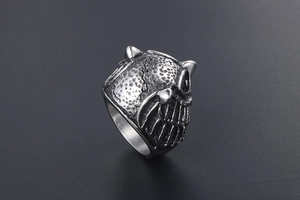 Detailed close-up of owl head ring showing antique silver finish and textured feather carving