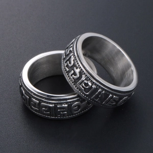 Vintage titanium steel rings with embossed religious symbols and oxidized finish