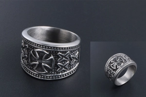 Detail view of retro stainless steel ring with Maltese cross and brushed metal finish