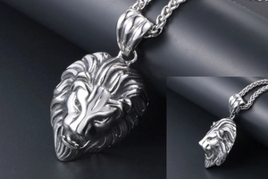 Relief détaillé du pendentif tête de lion avec chaîne tressée en acier inoxydable poli