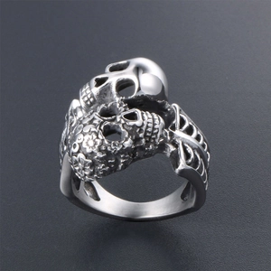 Gothic dual skull ring in matte silver finish with intricate rib bone pattern on the band