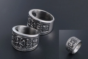 Macro detail of men's vintage titanium steel ring with Celtic cross and punk patterns