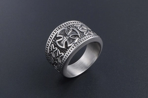 Macro shot of retro men's titanium steel cross ring with embossed star pattern details