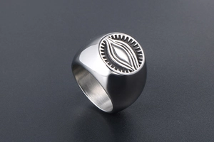 Detail of vintage God's Eye signet ring for men in brushed titanium steel