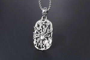 Detail of silver spider shield pendant with hollow grid and carved skull on bail