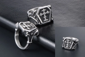 Macro detail of gothic coffin ring in vintage silver featuring embossed cross