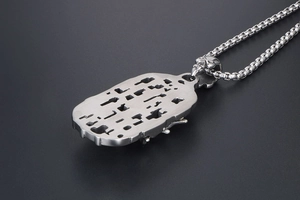 Detailed back view of silver gothic skeleton skull pendant with hollow geometric cutout