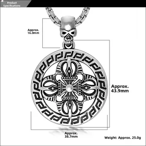 Macro shot of vintage titanium steel skull pendant with cross motif and Greek key border