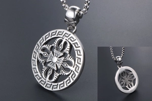 Detail of vintage titanium steel necklace with Greek key pattern and skull clasp