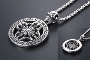 Detail of vintage titanium steel necklace with skull clasp and Greek key pendant