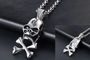 Macro view of vintage punk skull and crossbones pendant in silver stainless steel