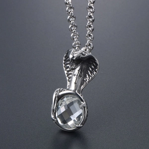 Punk style silver cobra snake pendant necklace with a large clear round faceted crystal